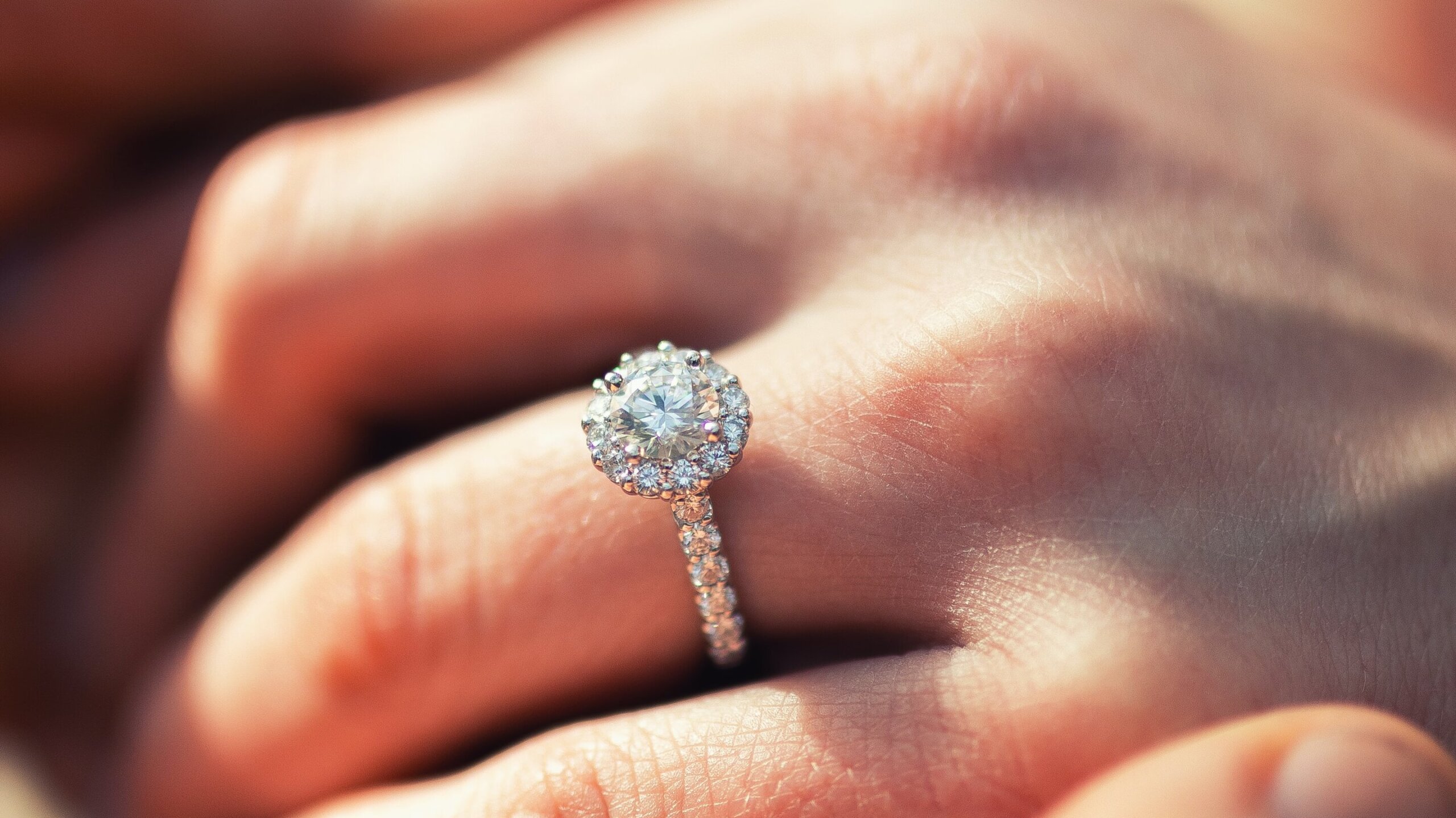 holding hands with halo diamond ring pave setting - The Pavé Setting