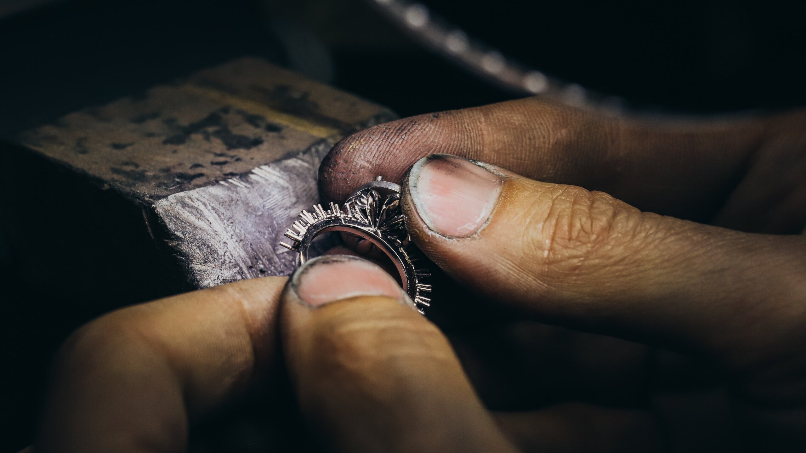 jeweler creating diamond ring - The Pavé Setting