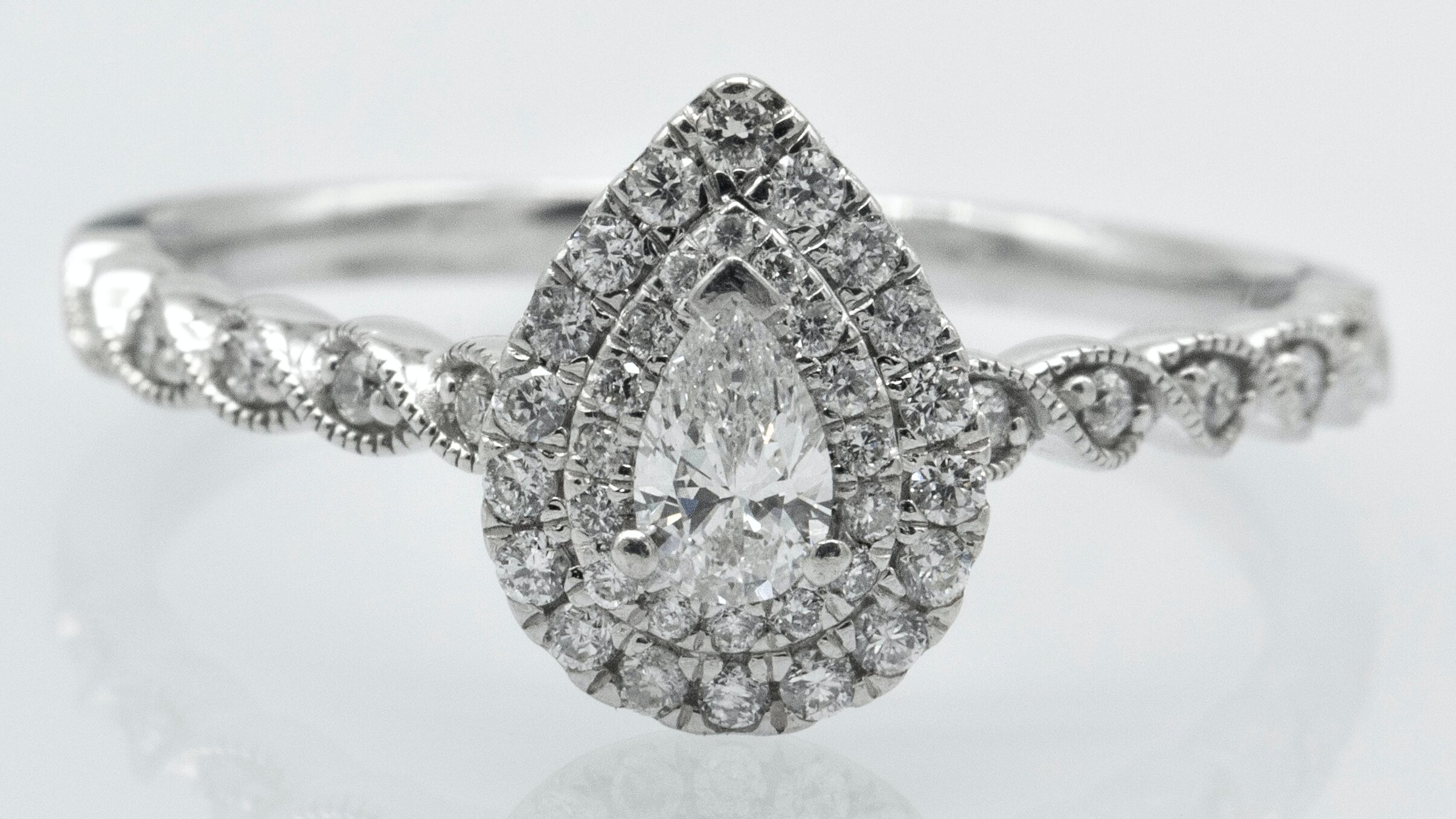 pear shaped halo engagement ring 