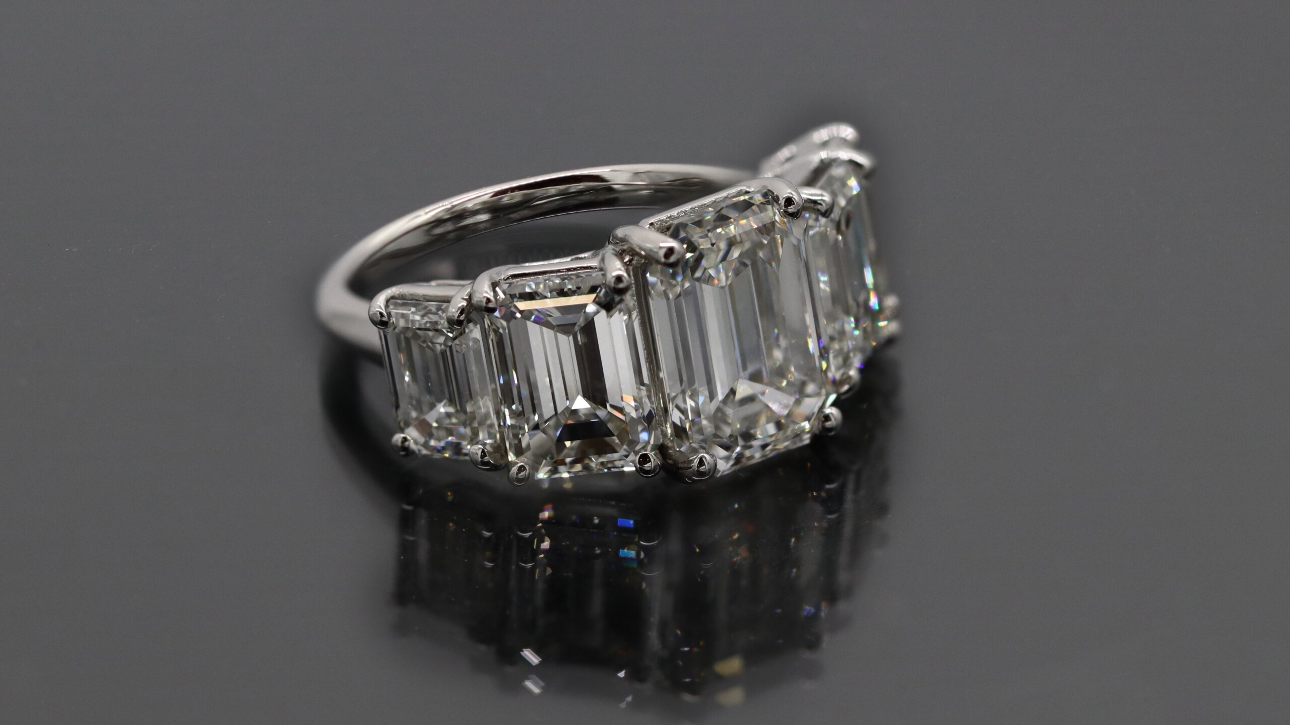 3 stone emerald cut diamond engagement ring 