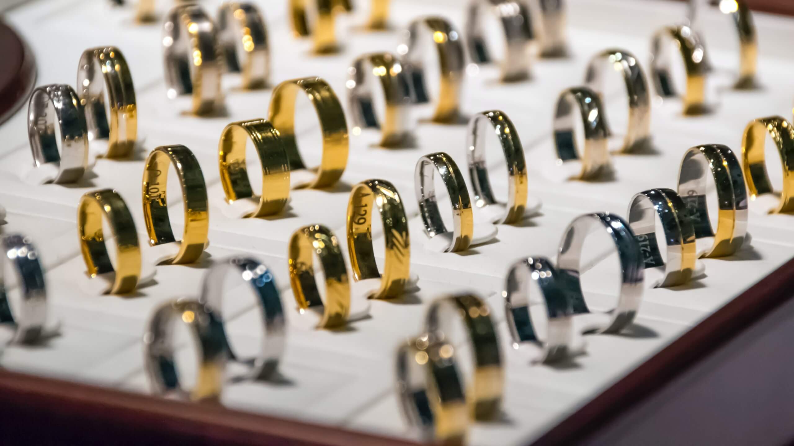 gold rings in jeweler showcase 