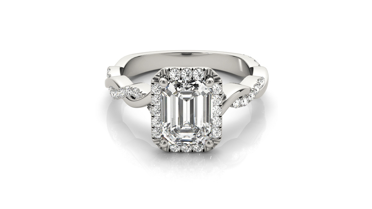 merald-cut diamond ring with a halo of round diamonds and a twisted, diamond-studded band in polished white metal.