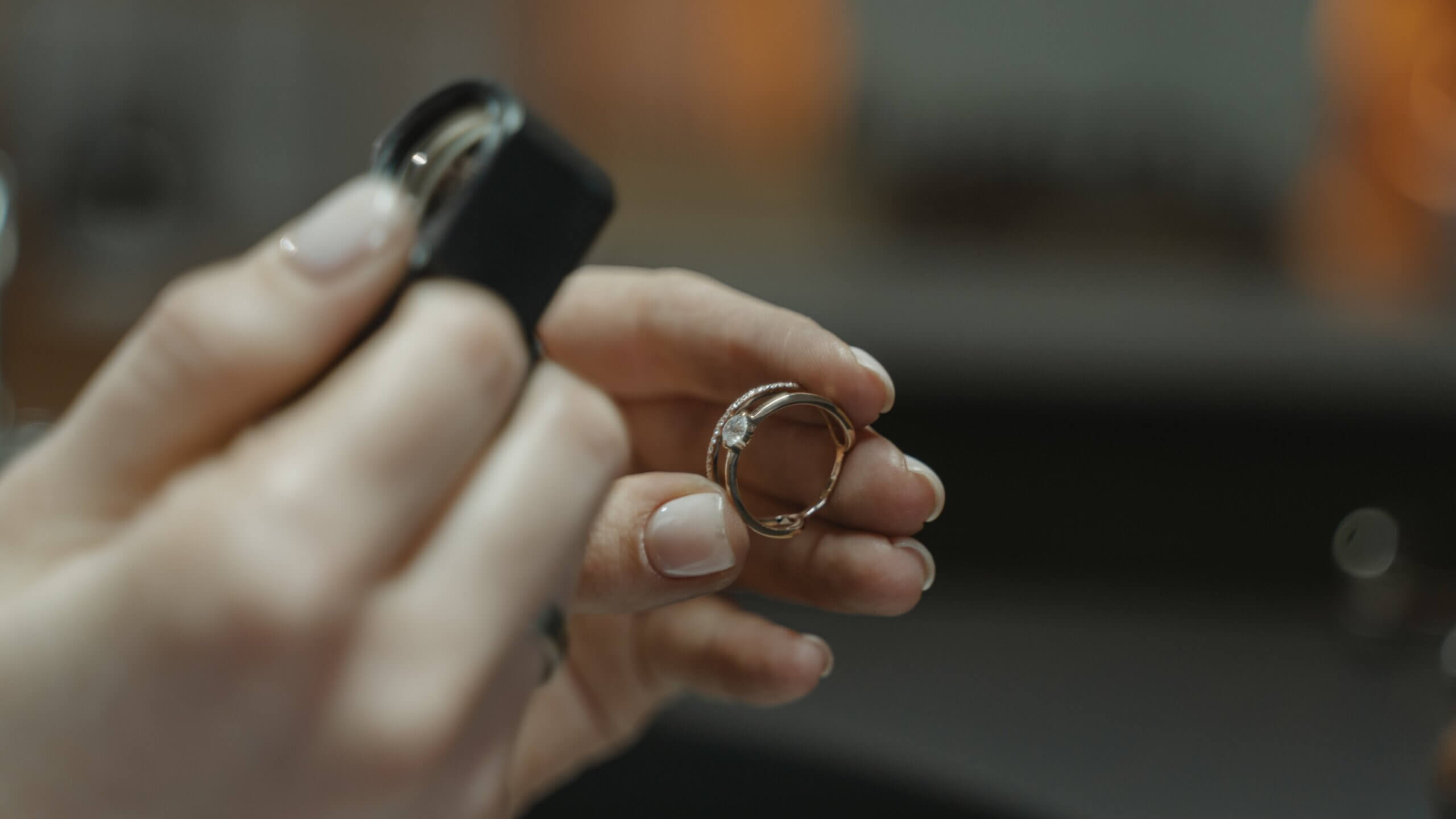 jeweler checking engagement ring for color - Diamond Color