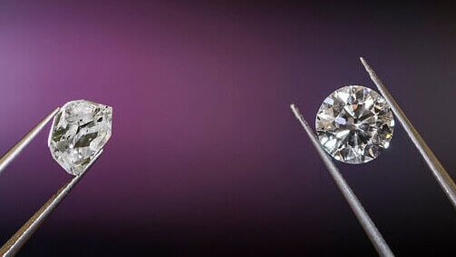 round diamond and rough diamond in tweezers